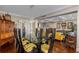 Bright dining room featuring a glass top table, hardwood floors, and a decorative built-in cabinet at 2660 Peachtree Nw Rd # 13F, Atlanta, GA 30305