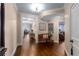 Elegant hallway with dark hardwood floors, decorative lighting, and access to living areas with city views at 2660 Peachtree Nw Rd # 13F, Atlanta, GA 30305