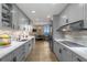 Open-concept kitchen with modern appliances, stylish cabinets, and a breakfast nook area at 2660 Peachtree Nw Rd # 13F, Atlanta, GA 30305