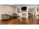 Inviting living room features a fireplace, built-in shelves, and stylish seating for relaxation and entertainment at 2660 Peachtree Nw Rd # 13F, Atlanta, GA 30305