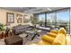 Bright living room featuring modern furniture, artwork, and floor-to-ceiling windows with scenic views at 2660 Peachtree Nw Rd # 13F, Atlanta, GA 30305