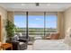 This main bedroom has great views and a sliding door to a private balcony with comfortable outdoor seating at 2660 Peachtree Nw Rd # 13F, Atlanta, GA 30305
