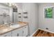 Bathroom with vanity featuring a beige countertop and a window at 1000 Coan Dr, Locust Grove, GA 30248