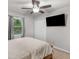 Bright bedroom with a large closet, TV, and a window view at 1000 Coan Dr, Locust Grove, GA 30248