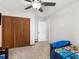Bedroom with a ceiling fan, closet, and access to the ensuite bathroom at 1000 Coan Dr, Locust Grove, GA 30248