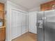 Kitchen featuring stainless steel refrigerator, cabinets and closet at 1000 Coan Dr, Locust Grove, GA 30248