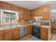 Kitchen featuring stainless steel dishwasher, and sink at 1000 Coan Dr, Locust Grove, GA 30248