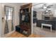 Functional mud room with custom built-in storage, opening to the inviting living room and fireplace at 1000 Coan Dr, Locust Grove, GA 30248