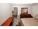 Bedroom showcasing a dresser with mirror and access to other rooms at 1964 Cutters Mill Way, Lithonia, GA 30058