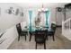 Bright dining room with glass-top table, black chairs, and stylish decor at 1964 Cutters Mill Way, Lithonia, GA 30058