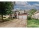 Charming two-story brick home with a spacious driveway and attached two-car garage at 1964 Cutters Mill Way, Lithonia, GA 30058