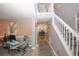 Hallway view of the dining area, complete with white staircase and neutral walls at 1964 Cutters Mill Way, Lithonia, GA 30058