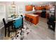 Bright kitchen features wood cabinets, stainless steel appliances, bar stool seating and adjacent dining area at 1964 Cutters Mill Way, Lithonia, GA 30058