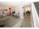 Inviting living room with neutral walls, gray carpet, and adjacent dining area at 1964 Cutters Mill Way, Lithonia, GA 30058