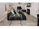 Comfortable living room featuring a fireplace and trendy decor, flowing into the dining and kitchen areas at 1964 Cutters Mill Way, Lithonia, GA 30058