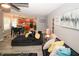Open floor plan showcases the living room and kitchen with trendy furnishings and updated flooring at 1964 Cutters Mill Way, Lithonia, GA 30058