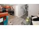 Open-concept living area showcases modern finishes, gray walls, wood-look flooring, and staircase at 1964 Cutters Mill Way, Lithonia, GA 30058
