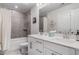 Stylish bathroom features a double vanity, large mirror, tub shower, and modern fixtures at 505 Hampton Crossing, Woodstock, GA 30188