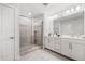 Modern bathroom featuring a glass enclosed shower, double vanity, and sleek design at 505 Hampton Crossing, Woodstock, GA 30188