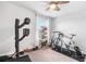Bright bedroom converted to a workout room with exercise equipment and a shoe rack at 505 Hampton Crossing, Woodstock, GA 30188