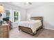 Bedroom filled with light from a window and a wood-framed bed and desk at 505 Hampton Crossing, Woodstock, GA 30188