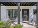 Charming front entrance with a decorative leaded glass front door and black trim at 505 Hampton Crossing, Woodstock, GA 30188