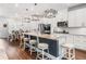 Modern kitchen with white cabinets, granite countertops, an island, and stainless steel appliances at 505 Hampton Crossing, Woodstock, GA 30188