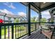 Relaxing outdoor porch featuring a view of the community and a seating area at 505 Hampton Crossing, Woodstock, GA 30188