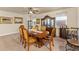Elegant dining room with a large wooden table, chairs, and decorative cabinet at 12148 Flannery Ln, Hampton, GA 30228