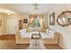 Inviting living area with a white sectional sofa and bright natural light at 12148 Flannery Ln, Hampton, GA 30228
