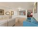 Spacious living area with a chandelier, connecting to a dining room at 12148 Flannery Ln, Hampton, GA 30228