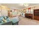 Comfortable living room featuring stylish decor, a piano, and ample seating at 12148 Flannery Ln, Hampton, GA 30228
