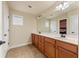 Bathroom with double sink vanity, tile floors, and plenty of counter space at 12148 Flannery Ln, Hampton, GA 30228