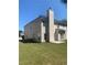 Well-maintained backyard with a chimney feature and plenty of green space for outdoor enjoyment at 2118 Water Mill Ct, Buford, GA 30519