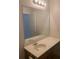 Bathroom features a large mirror, a sink, a vanity, and a light fixture at 2118 Water Mill Ct, Buford, GA 30519
