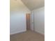 A tidy bedroom with neutral walls and carpet with walk-in closet at 2118 Water Mill Ct, Buford, GA 30519
