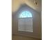 Bright bedroom with a large arched window and neutral decor at 2118 Water Mill Ct, Buford, GA 30519