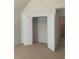 A bedroom closet with bi-fold doors is open to show ample storage at 2118 Water Mill Ct, Buford, GA 30519