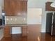 Built-in desk area featuring drawers and cabinets, adjacent to the kitchen and dining room at 2118 Water Mill Ct, Buford, GA 30519