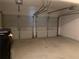 Two-car garage featuring two garage door openers and ample space for vehicles and storage at 2118 Water Mill Ct, Buford, GA 30519