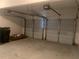 Two-car garage interior featuring two garage door openers and abundant space at 2118 Water Mill Ct, Buford, GA 30519