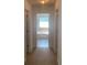 Hallway with a view into a bathroom with a soaking tub at 2118 Water Mill Ct, Buford, GA 30519
