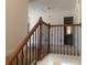 Upstairs hallway featuring a wrought iron banister and carpeted floor at 2118 Water Mill Ct, Buford, GA 30519