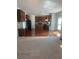 Open-concept kitchen with wood floors, granite counters, and stainless steel appliances at 2118 Water Mill Ct, Buford, GA 30519