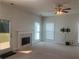 Bright open living room with a fireplace, ceiling fan, and tv mount at 2118 Water Mill Ct, Buford, GA 30519