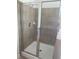 Tiled shower with a sliding glass door at 2118 Water Mill Ct, Buford, GA 30519