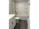 Bathroom with gray floors, white vanity and shower over tub combo at 3382 Milan Ct # 3 Appx/Plan Sqft 3327, Douglasville, GA 30135