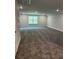 Expansive bonus room featuring plush carpeting and a window, providing a flexible space for recreation, entertainment, or hobbies at 3382 Milan Ct # 3 Appx/Plan Sqft 3327, Douglasville, GA 30135