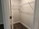 Walk-in closet featuring neutral walls, carpeted floor and metal shelving for storage at 3382 Milan Ct # 3 Appx/Plan Sqft 3327, Douglasville, GA 30135