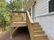 Exterior view of a deck with stairs attached to a home with siding and a white brick foundation at 3382 Milan Ct # 3 Appx/Plan Sqft 3327, Douglasville, GA 30135